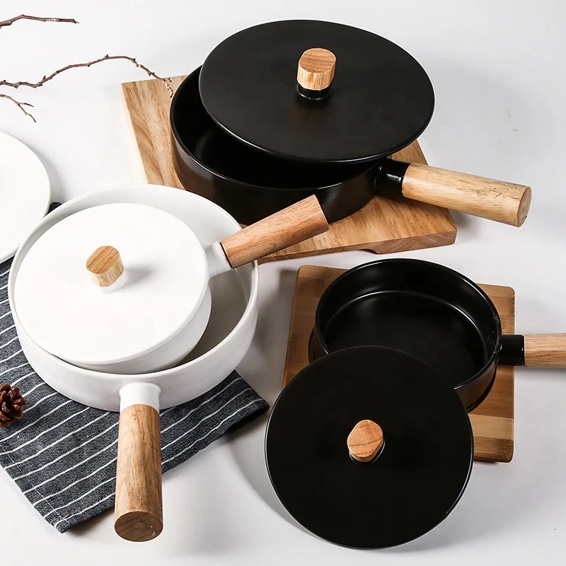 Factory direct sales of new western-style open flame ceramic pot with wooden handle household baking baking plate casserole
Factory direct sales of new western-style open flame ceramic pot with wooden handle household baking baking plate casserole