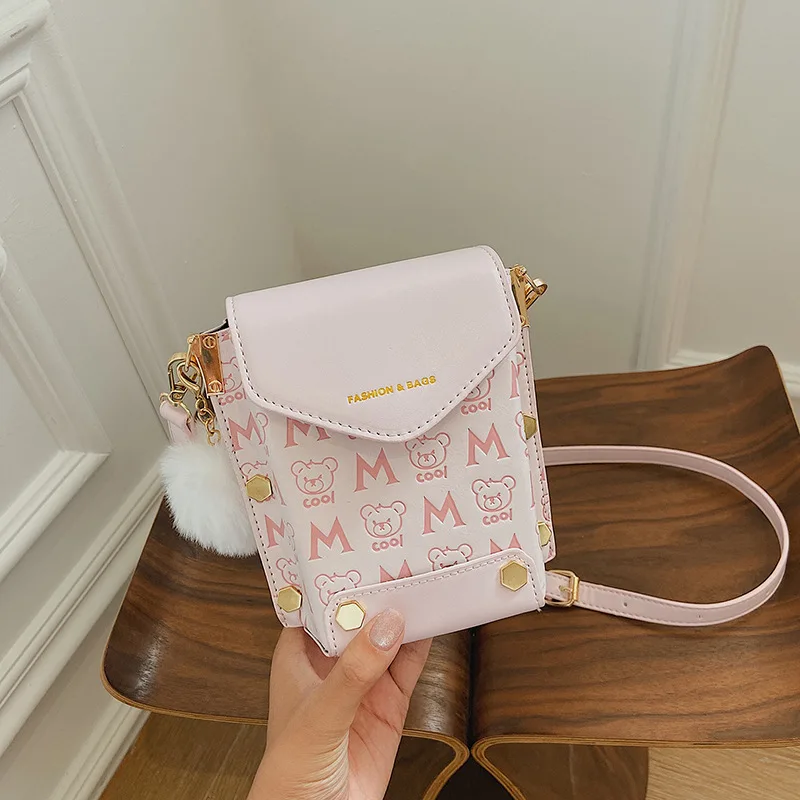 Fashion mobile phone bag 2021 cute printing designer hand bag ladies rivet mini purse and handbag with fur ball decoration
Fashion mobile phone bag 2021 cute printing designer hand bag ladies rivet mini purse and handbag with fur ball decoration