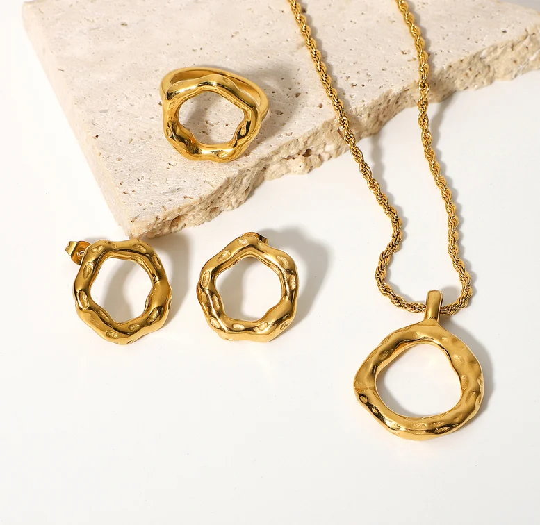 Luxury gold stainless steel necklace ring earring circle motif textured jewelry set for women
Luxury gold stainless steel necklace ring earring circle motif textured jewelry set for women