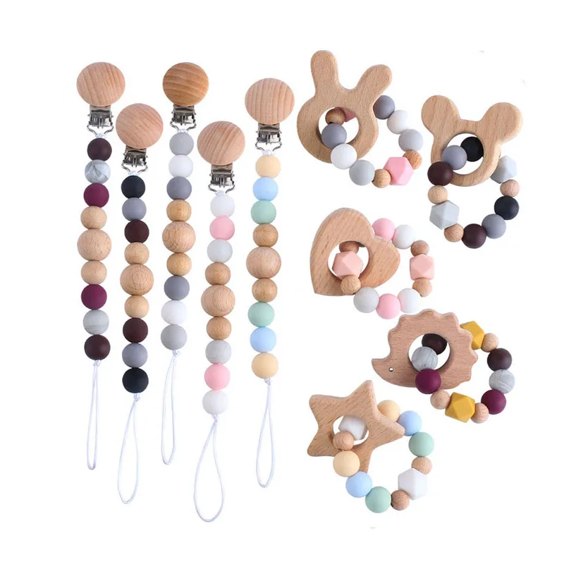 

Customized Toddler Chewing Training Pacifier Holder with Soother Clips and Teether Ring Set Silicone Wooden Baby Pacifier Chain