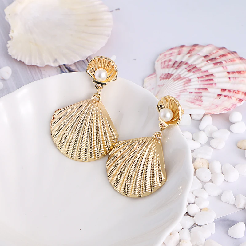 2019 New Design Personalized Pearl and Gold Alloy Shell Conch Girls Summer Elegant Metal Earrings For Women Gold Jewelry
2019 New Design Personalized Pearl and Gold Alloy Shell Conch Girls Summer Elegant Metal Earrings For Women Gold Jewelry