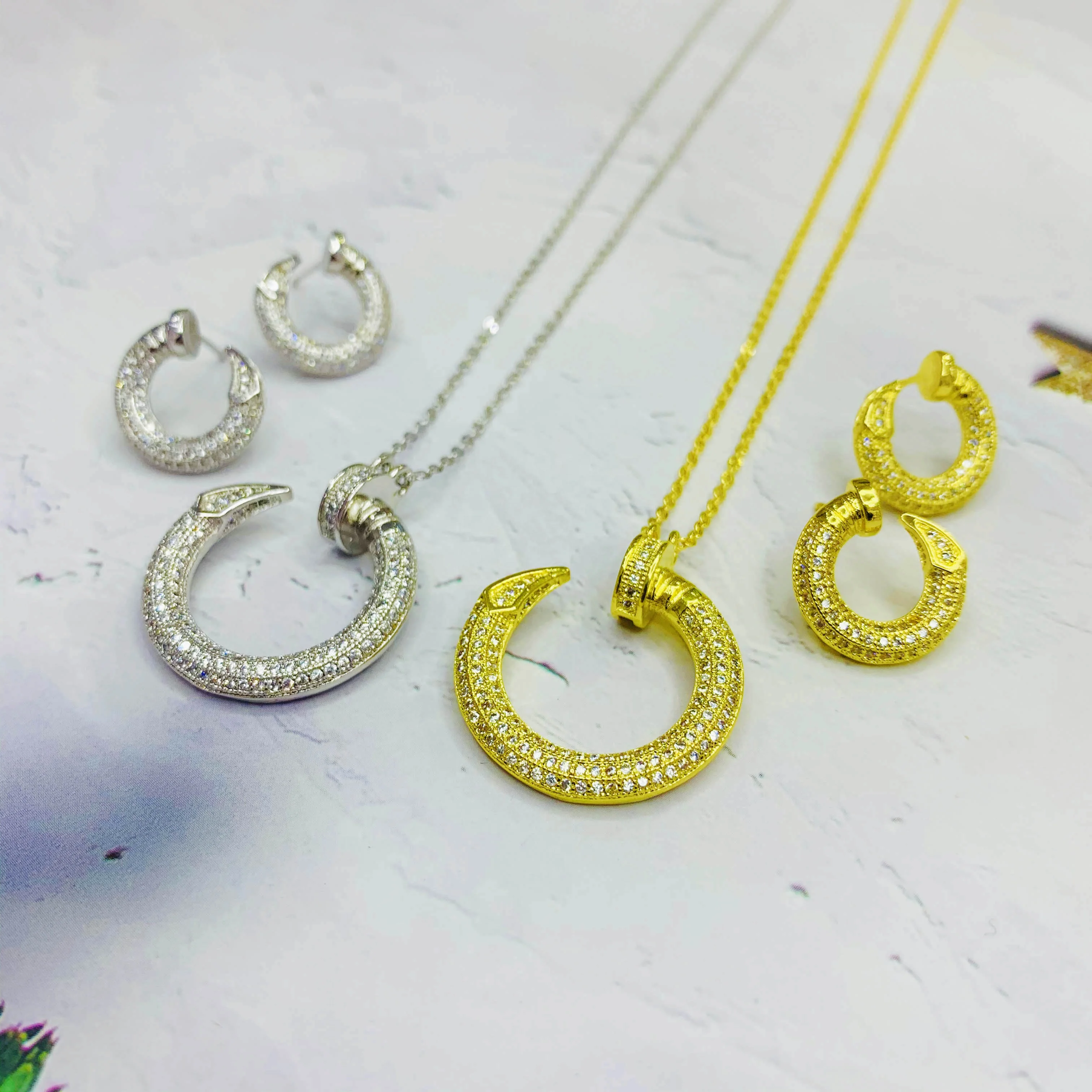 Hot sale fashion round nail shape necklace earring 2pcs jewelry sets gold plated brand jewelry set
Hot sale fashion round nail shape necklace earring 2pcs jewelry sets gold plated brand jewelry set
