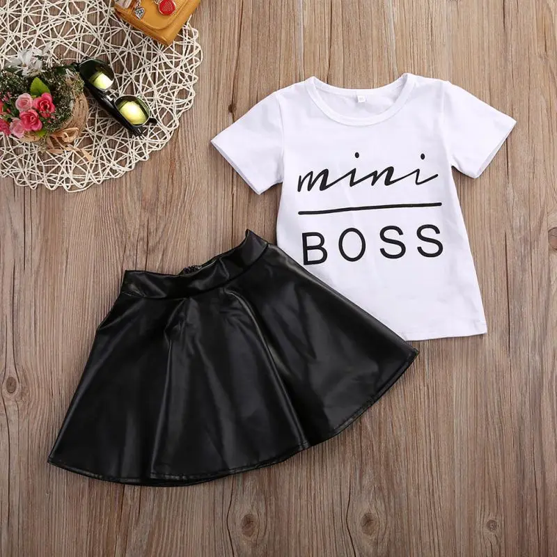 Conyson Wholesale Short Sleeve Pu Leather print logo Skirt Korean Child Girls Summer 2Pcs Clothes Clothing Set
Conyson Wholesale Short Sleeve Pu Leather print logo Skirt Korean Child Girls Summer 2Pcs Clothes Clothing Set