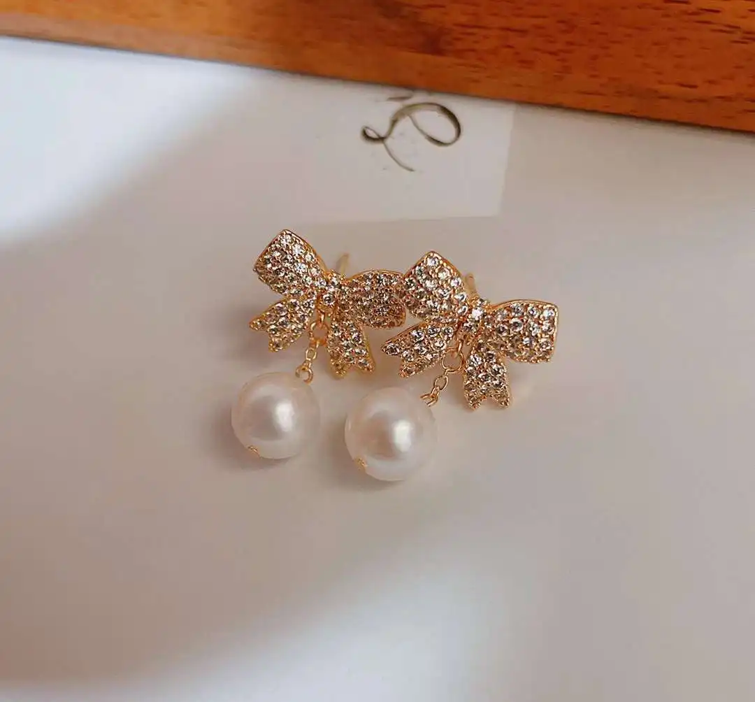 14K gold filled bow stud earrings with round high quality freshwater pearl earrings
14K gold filled bow stud earrings with round high quality freshwater pearl earrings