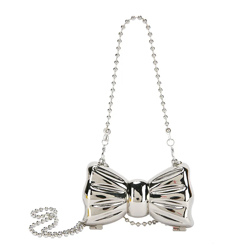 Personality metal mini bag 2021 European and American INS girl chain bowknot dinner bag, Silver
Personality metal mini bag 2021 European and American INS girl chain bowknot dinner bag, Silver