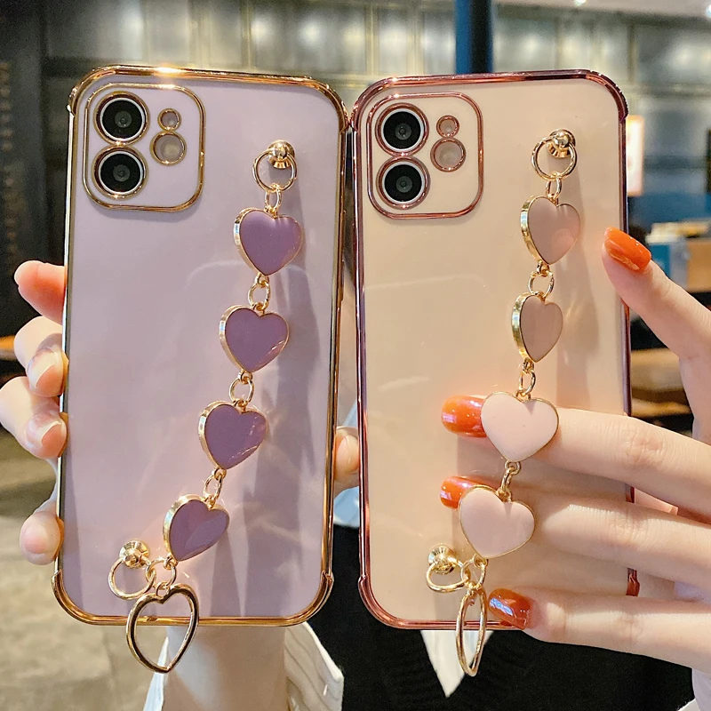 Luxury Plating Edge Wrist Strap Heart Chain Case for iPhone 12 Mini 11 Pro XS Max Wristband Hand Holder Shockproof Soft Cover
Luxury Plating Edge Wrist Strap Heart Chain Case for iPhone 12 Mini 11 Pro XS Max Wristband Hand Holder Shockproof Soft Cover