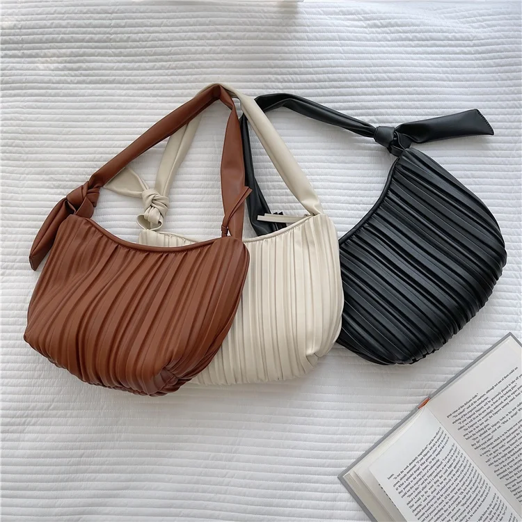 New fashion casual handbag pleated chic shopping shoulder bag can be customized logo tie strap PU leather women's Tote bag
New fashion casual handbag pleated chic shopping shoulder bag can be customized logo tie strap PU leather women's Tote bag