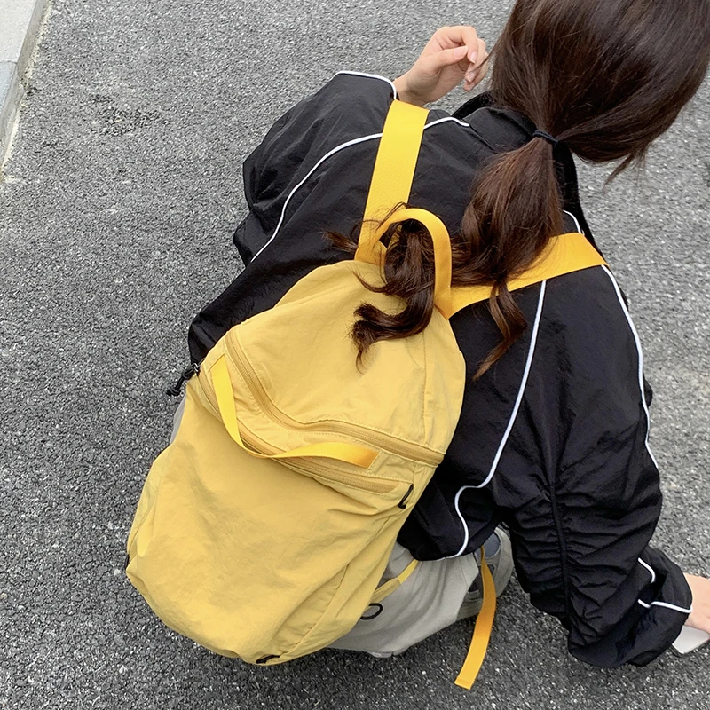 Korean Nylon Lightweight Backpack Goose Yellow Ribbon Shoulder Strap Lady Backpack Large Capacity Student Fashion Schoolbag
Korean Nylon Lightweight Backpack Goose Yellow Ribbon Shoulder Strap Lady Backpack Large Capacity Student Fashion Schoolbag