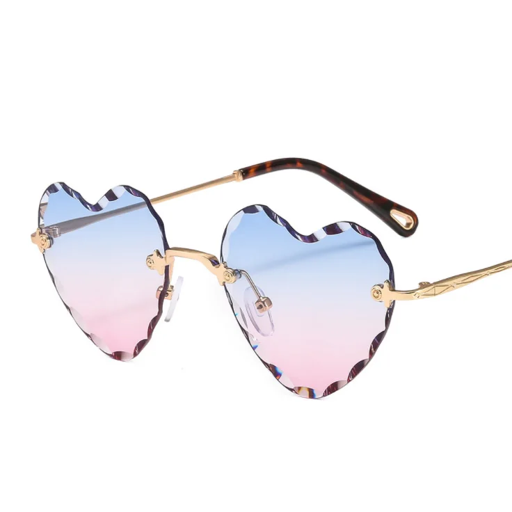 New style frameless thick edge cut peach heart inverted edge wavy cross border net red luxury women's sunglasses
New style frameless thick edge cut peach heart inverted edge wavy cross border net red luxury women's sunglasses