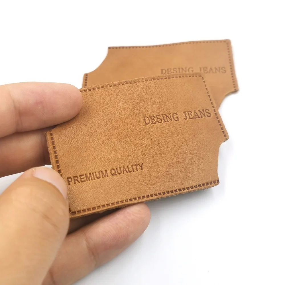 Wholesale embossed print custom name size logo leather label jeans sticker label logo, Custom color
Wholesale embossed print custom name size logo leather label jeans sticker label logo, Custom color