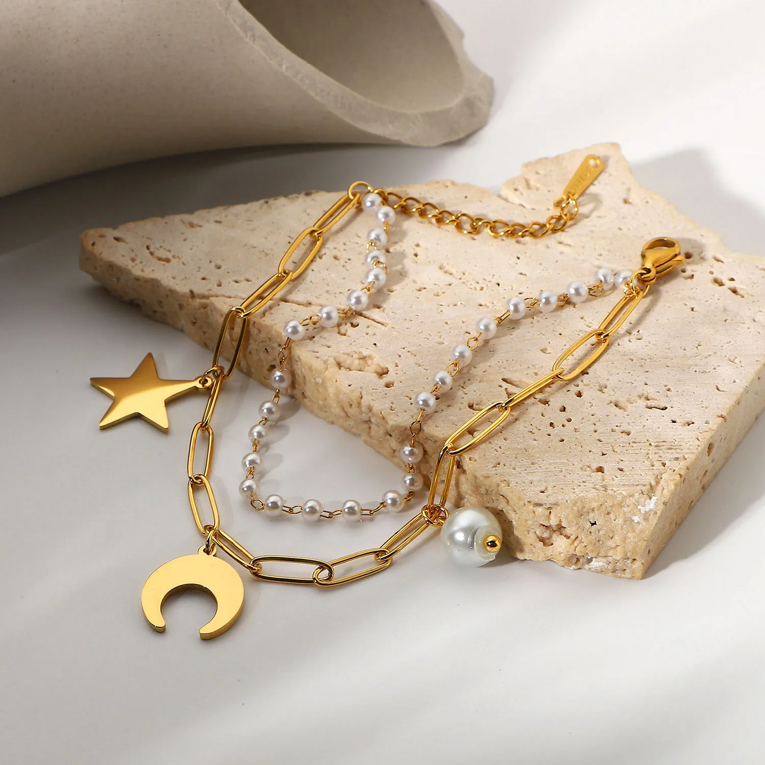 INS18K Gold plated stainless steel Star Moon Pearl Pendant Double layer bracelet for ladies
INS18K Gold plated stainless steel Star Moon Pearl Pendant Double layer bracelet for ladies