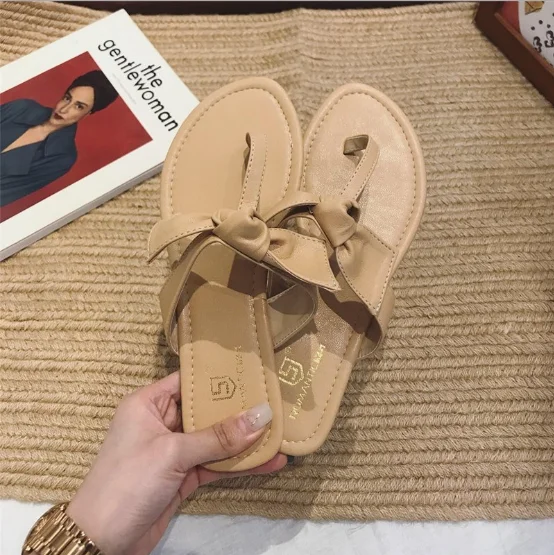 Summer's new toe clip T-shaped sweet bow flat bottom sandals Holiday Beach, Black,camel,yellow,white 
Summer's new toe clip T-shaped sweet bow flat bottom sandals Holiday Beach, Black,camel,yellow,white