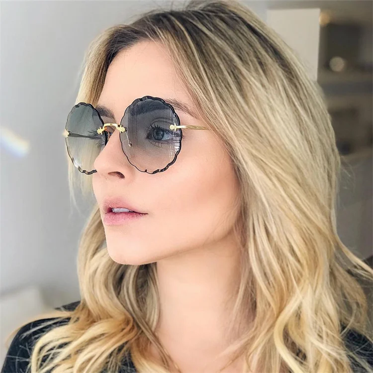 New style rimless wholesale shades sun glasses women metal gradient color round flower sunglasses
New style rimless wholesale shades sun glasses women metal gradient color round flower sunglasses