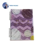 Spiral wired book with designer's hard cover and colorful printed inner pages