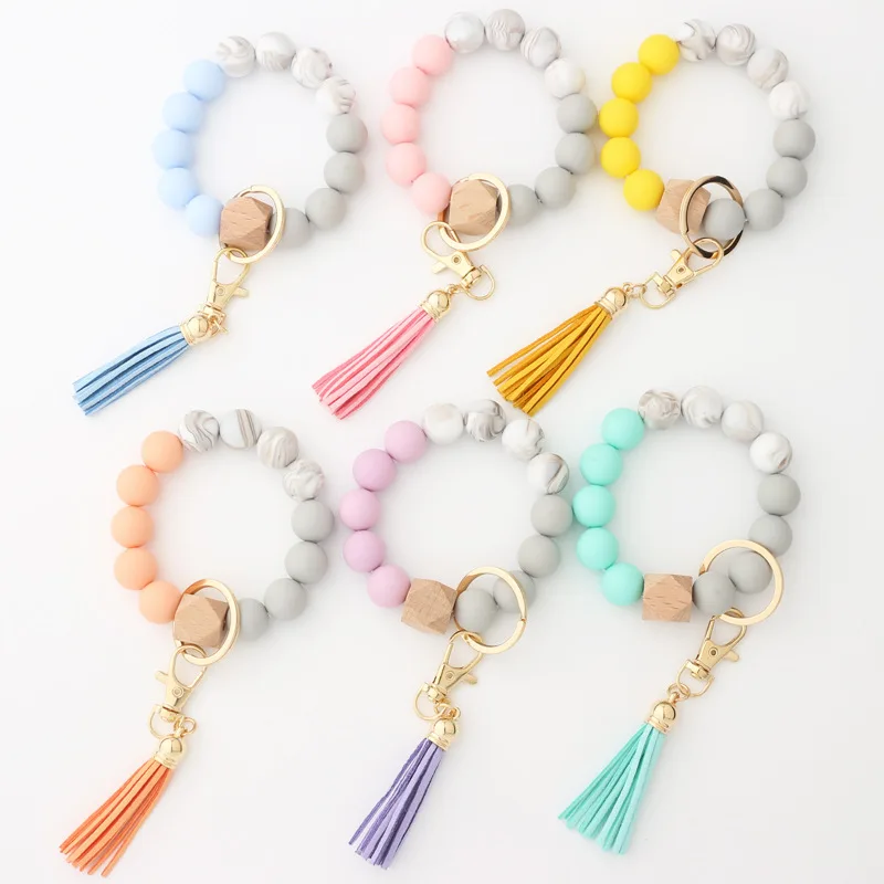 Hot Sell Summer Silicone Elastic Beaded With Wooden Beads Suede Tassel Wristlet Keychain
Hot Sell Summer Silicone Elastic Beaded With Wooden Beads Suede Tassel Wristlet Keychain