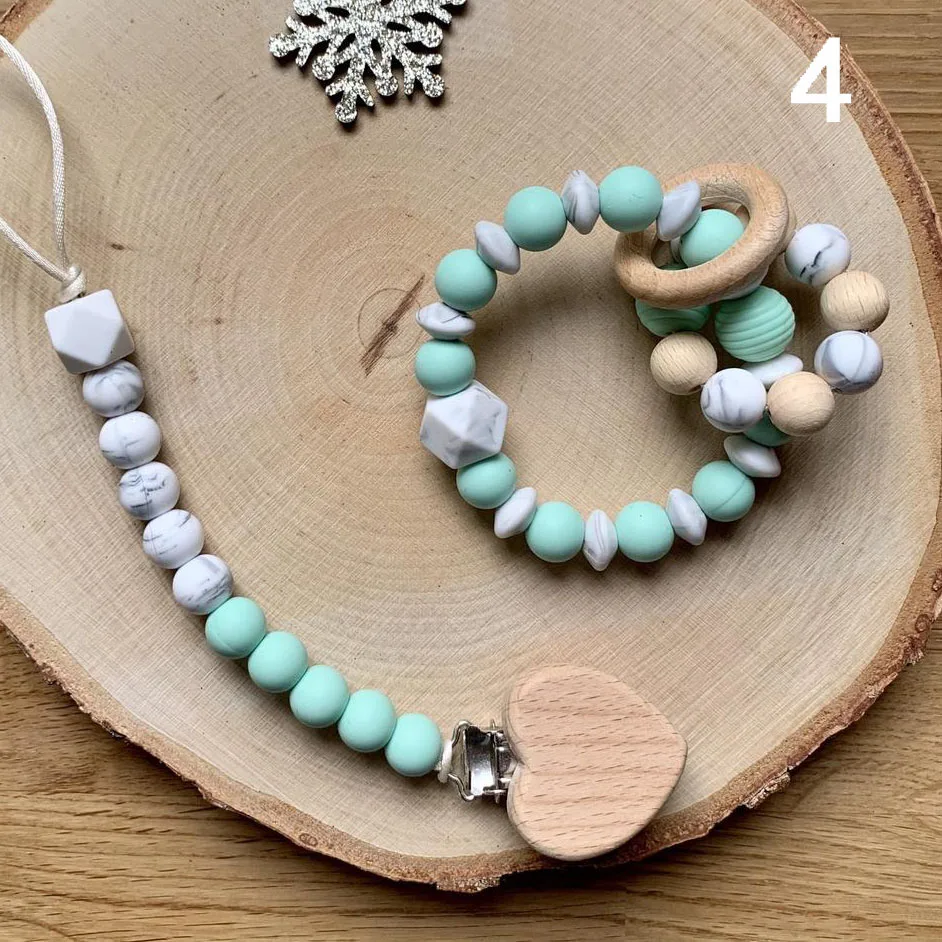 Hot Sale Silicone Beads Baby Soother Chain Silicone Teething Silicone Wooden Rattle Bracelet
Hot Sale Silicone Beads Baby Soother Chain Silicone Teething Silicone Wooden Rattle Bracelet