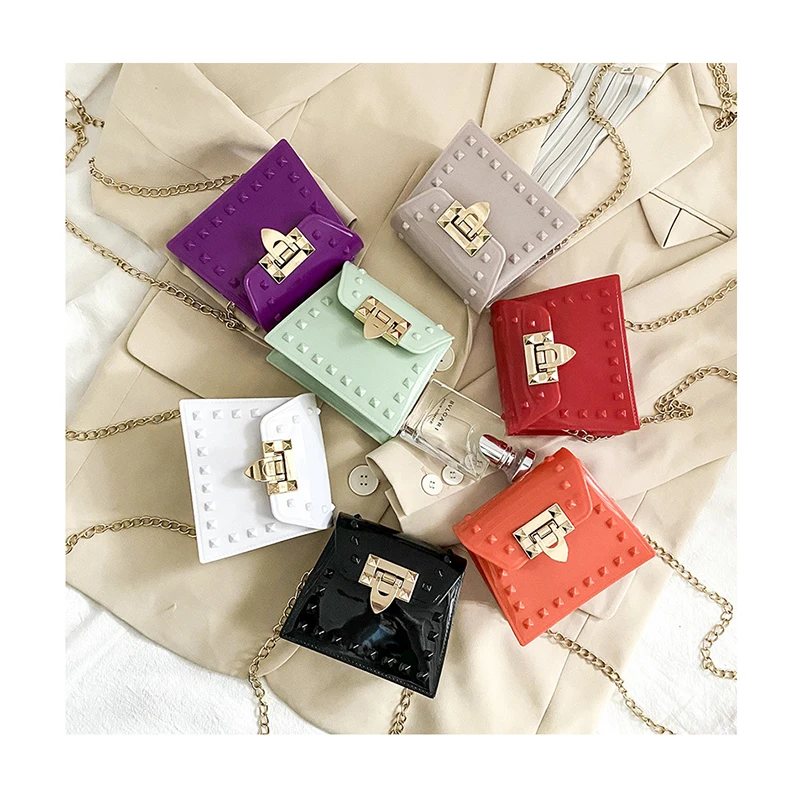 Women PVC Mini Handbag New Rivets Shoulder Messenger Portable Chain Purses Girl PVC Jelly Bag Crossbody Small Trapeze Bag
Women PVC Mini Handbag New Rivets Shoulder Messenger Portable Chain Purses Girl PVC Jelly Bag Crossbody Small Trapeze Bag