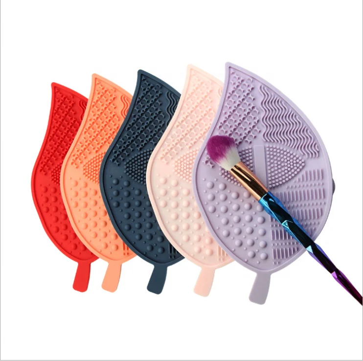 Makeup Brush Cleaning Mat Silicone Leaf Shape Makeup Brush Cleaner Pad Suction Cup Mat, Blue, pink, purple, orange, red
Makeup Brush Cleaning Mat Silicone Leaf Shape Makeup Brush Cleaner Pad Suction Cup Mat, Blue, pink, purple, orange, red