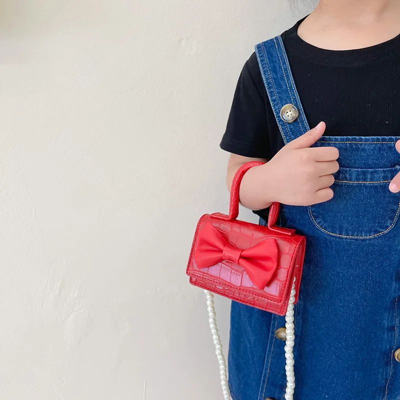 Ins new bow princess children and girls pearl portable slung accessories small change carry small bag women's bag
Ins new bow princess children and girls pearl portable slung accessories small change carry small bag women's bag
