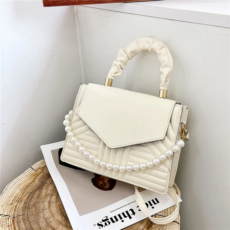 simple small square bag 2022 new retro personality pearl handbag candy color women shoulder messenger bag, As picture
simple small square bag 2022 new retro personality pearl handbag candy color women shoulder messenger bag, As picture
