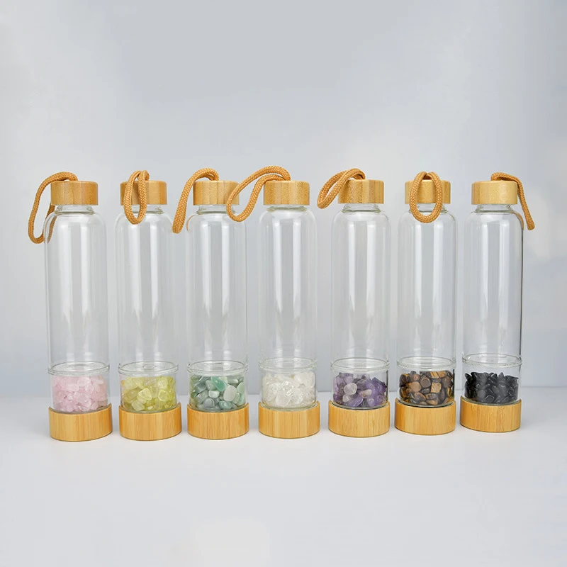 Custom bamboo lid glass gemstone water bottle healing elixir crystal water bottle, Clear
Custom bamboo lid glass gemstone water bottle healing elixir crystal water bottle, Clear
