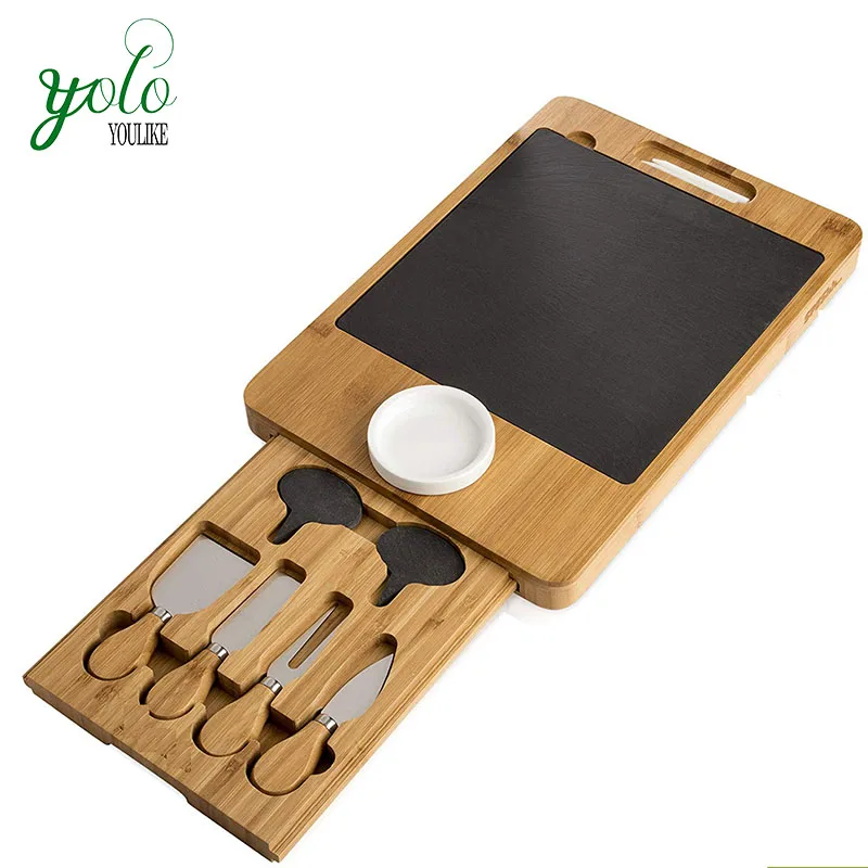 Custom gift Bamboo Slate Cheese Set, Serving Cutting Board tray with Cutlery and Drawer, Ceramic Bowl and Chalk, Natural
Custom gift Bamboo Slate Cheese Set, Serving Cutting Board tray with Cutlery and Drawer, Ceramic Bowl and Chalk, Natural