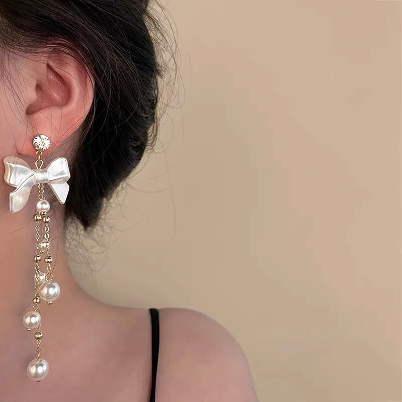 TongLing fashion trendy bowknot pearl tassel long drop dangle earring 
TongLing fashion trendy bowknot pearl tassel long drop dangle earring