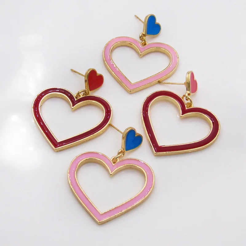 Ding yi Beautiful red love heart hollow long pendant earrings romantic alloy geometric earrings, Pink/red 
Ding yi Beautiful red love heart hollow long pendant earrings romantic alloy geometric earrings, Pink/red