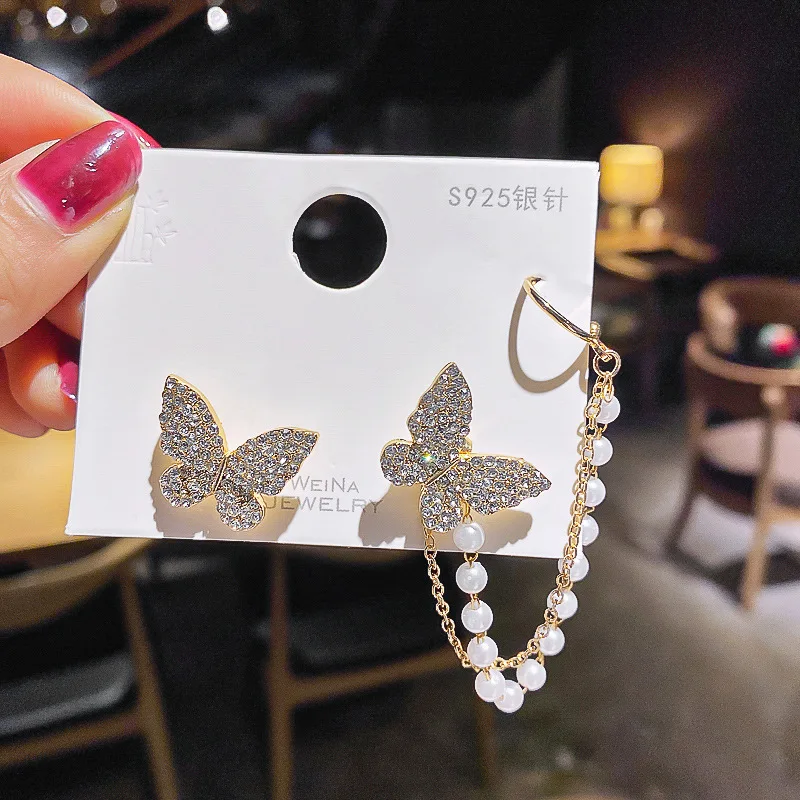Korean asymmetric full diamond butterfly pearl tassel temperament stainless butterfly studs clips earrings, Gold
Korean asymmetric full diamond butterfly pearl tassel temperament stainless butterfly studs clips earrings, Gold