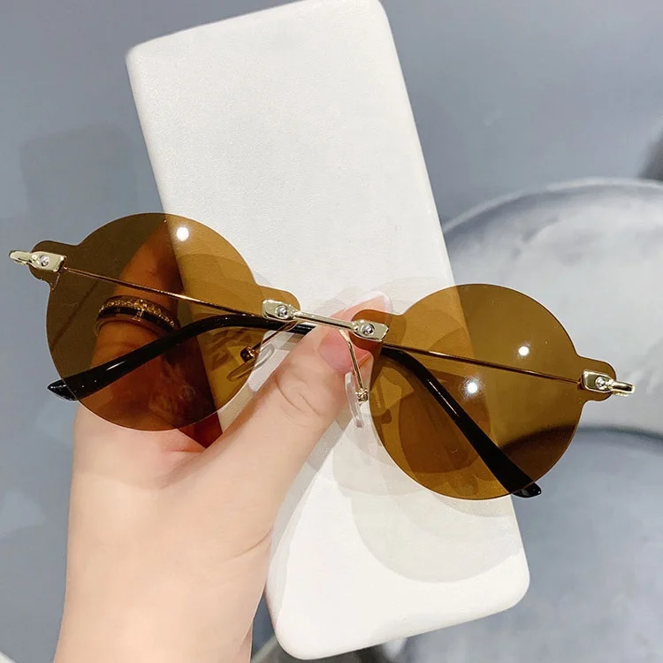 New Women Small Round Rimless Sunglasses Mens River Custom Designer Retro Shades Fashion Glasses Sunglasses, 7 color
New Women Small Round Rimless Sunglasses Mens River Custom Designer Retro Shades Fashion Glasses Sunglasses, 7 color