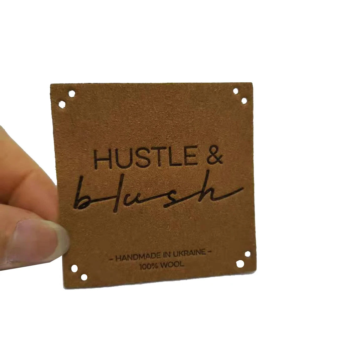 

Customized Suede Leather Patches Label With Embossed Deboosed Logo For JEANS Clothing Label, Custom color