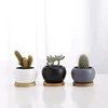 /product-detail/quality-3-5inch-ceramic-small-flower-pots-for-succulent-plants-with-bamboo-tray-wholesale-62198045087.html