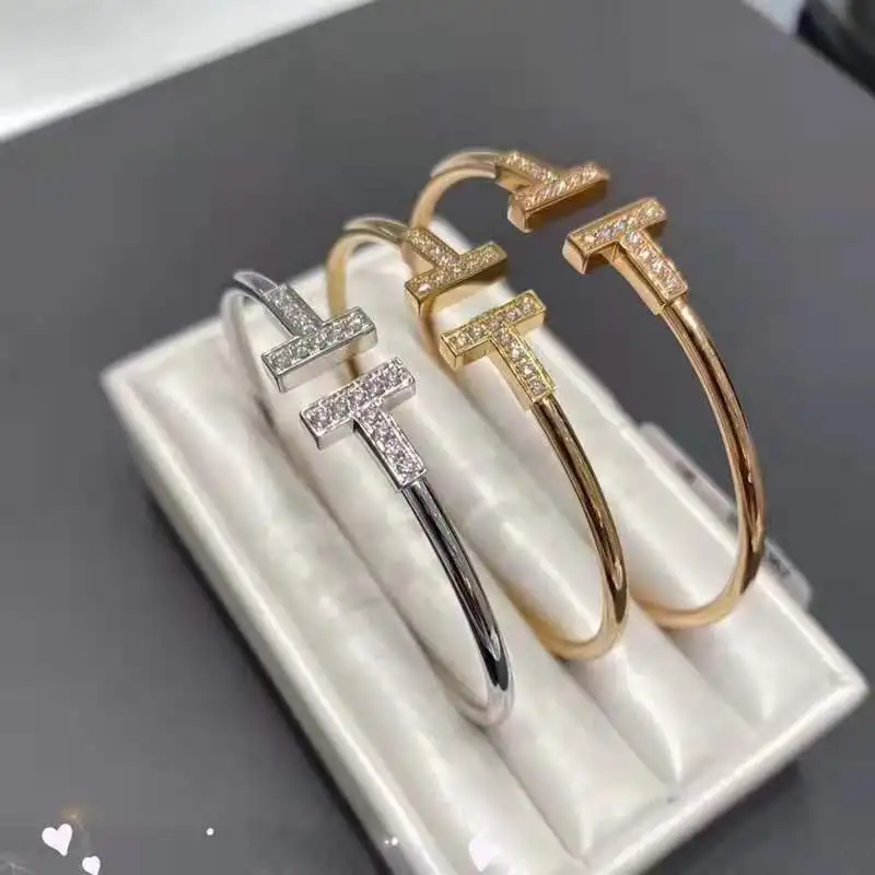Simple Design Double T Classic Stainless Steel Plated 18k Gold Diamond Inlaid opening bracelet for female Bangle
Simple Design Double T Classic Stainless Steel Plated 18k Gold Diamond Inlaid opening bracelet for female Bangle