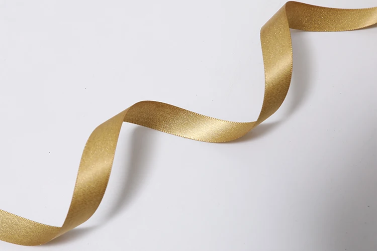 woven wired gold satin glitter edged metallic curling ribbon