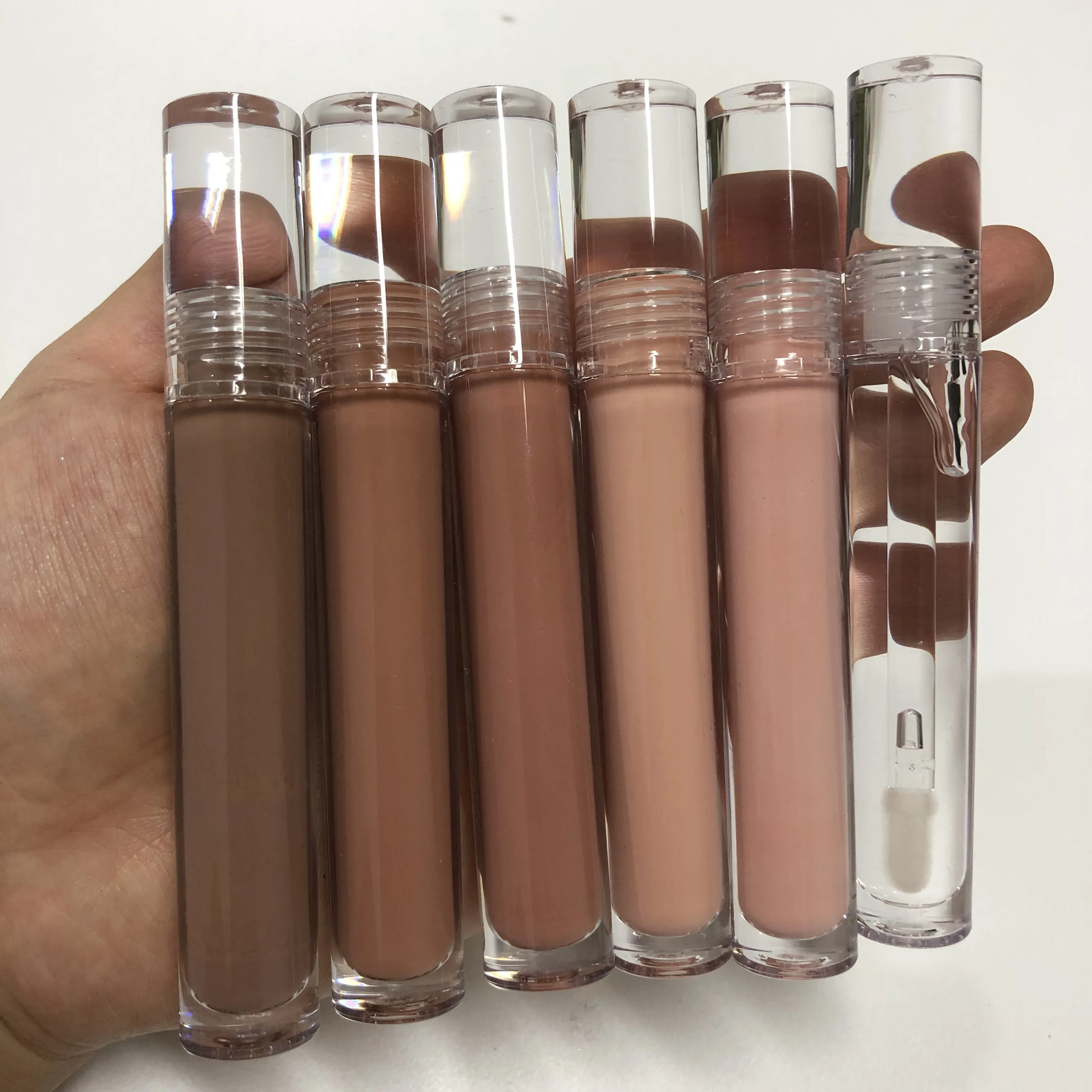 New trending nude lipgloss tube custom vegan clear pink brown clear and nude lipgloss
New trending nude lipgloss tube custom vegan clear pink brown clear and nude lipgloss