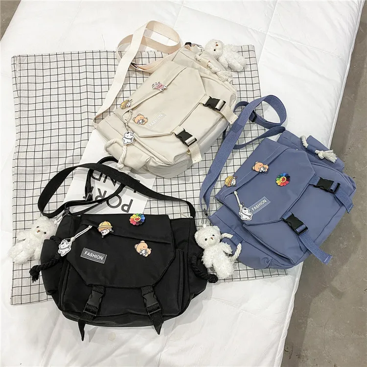 Custom Wholesale Trendy Leisure Bags Crossbody Shoulder Nylon Outer Messenger Square Bag With Cute Decoration
Custom Wholesale Trendy Leisure Bags Crossbody Shoulder Nylon Outer Messenger Square Bag With Cute Decoration
