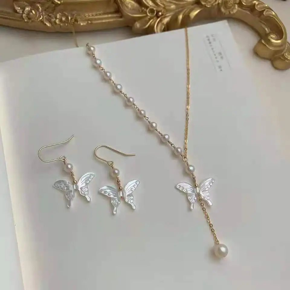 14K gold filled chain and earrings with round freshwater pearl butterfly shell necklace and earring set
14K gold filled chain and earrings with round freshwater pearl butterfly shell necklace and earring set