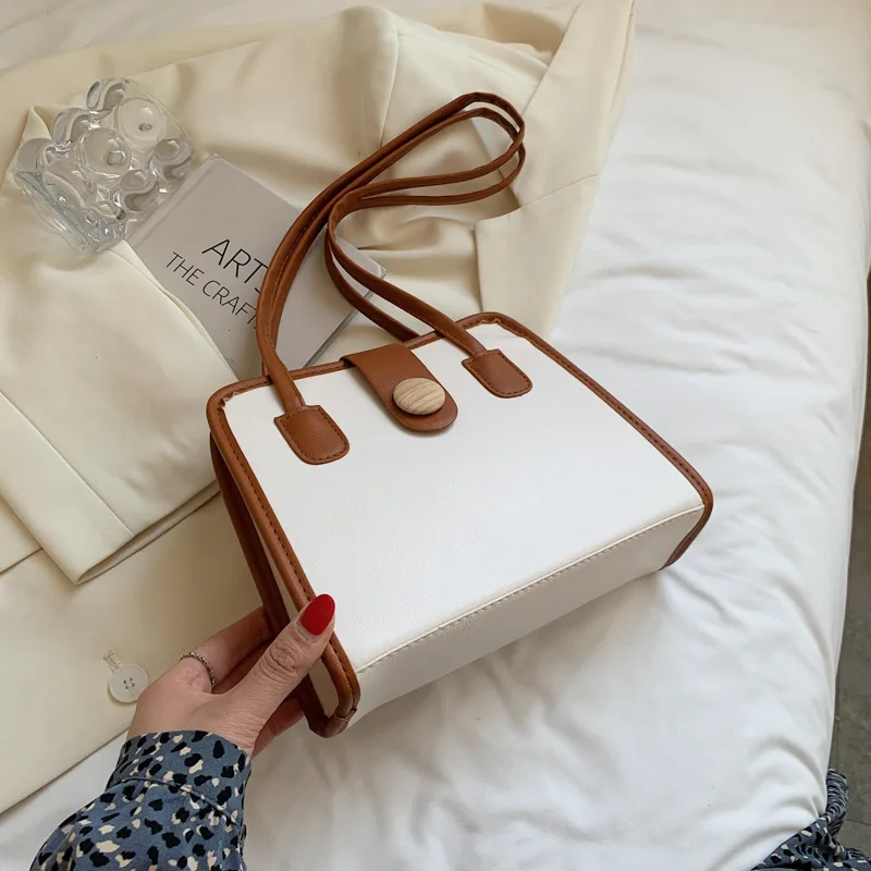 2021 New simple large capacity button shoulder bag wholesale girls shopping wallet and phone handbags, 2 colors
2021 New simple large capacity button shoulder bag wholesale girls shopping wallet and phone handbags, 2 colors