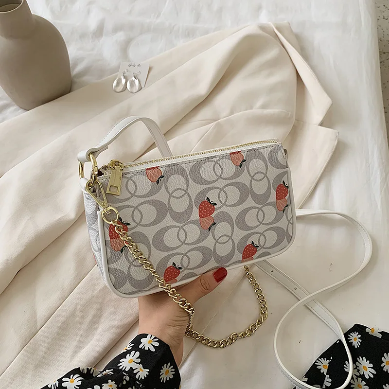 ST-0861 Strawberry Printing Alar Bag Fashion One Shoulder Inclined Across The Chain Small Summer Baguette Bag Women, Multi color
ST-0861 Strawberry Printing Alar Bag Fashion One Shoulder Inclined Across The Chain Small Summer Baguette Bag Women, Multi color