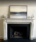 prefab modern design home decorations baby angel statue marble fireplace surround