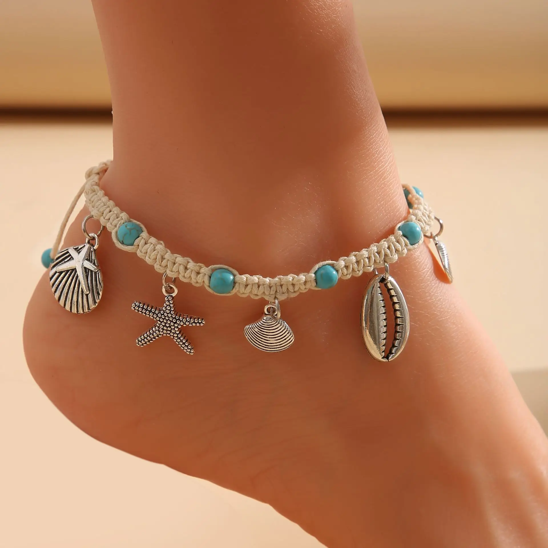 

Lateefah OEM Beach Foot Jewelry Wire Rope Starfish Wave Pattern Shell Pendant Inlaid Turquoise Anklet