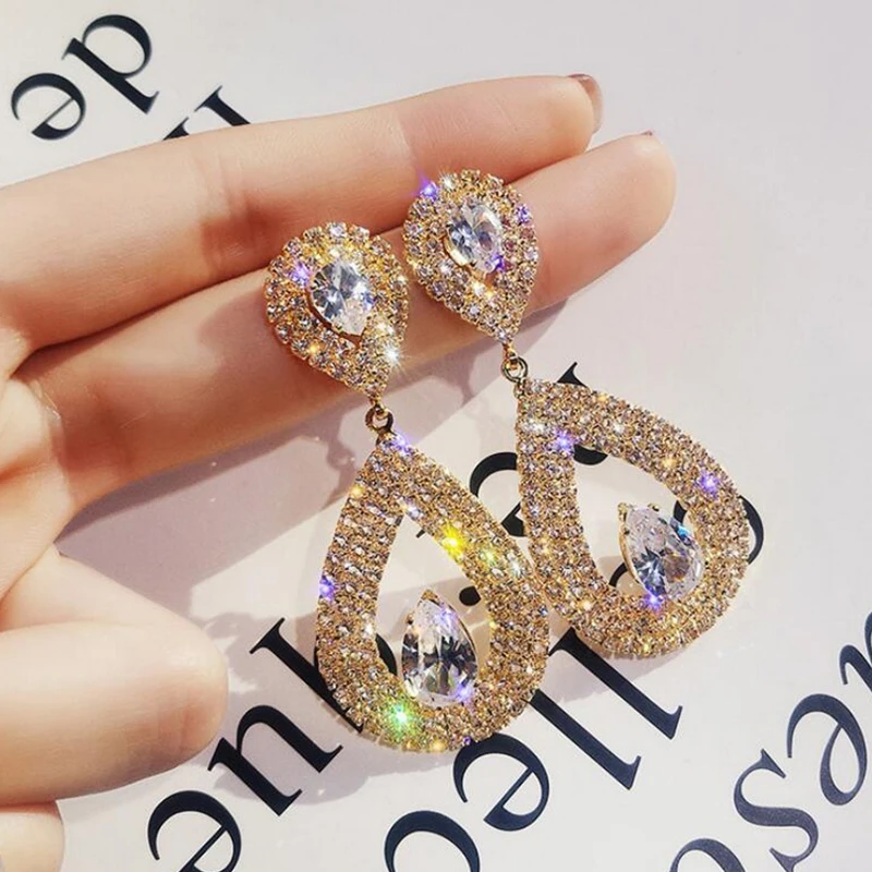 Korean Hollow Teardrop Shaped Pendant Earrings Full Diamond Shiny Rhinestone Drop Earrings For Women
Korean Hollow Teardrop Shaped Pendant Earrings Full Diamond Shiny Rhinestone Drop Earrings For Women