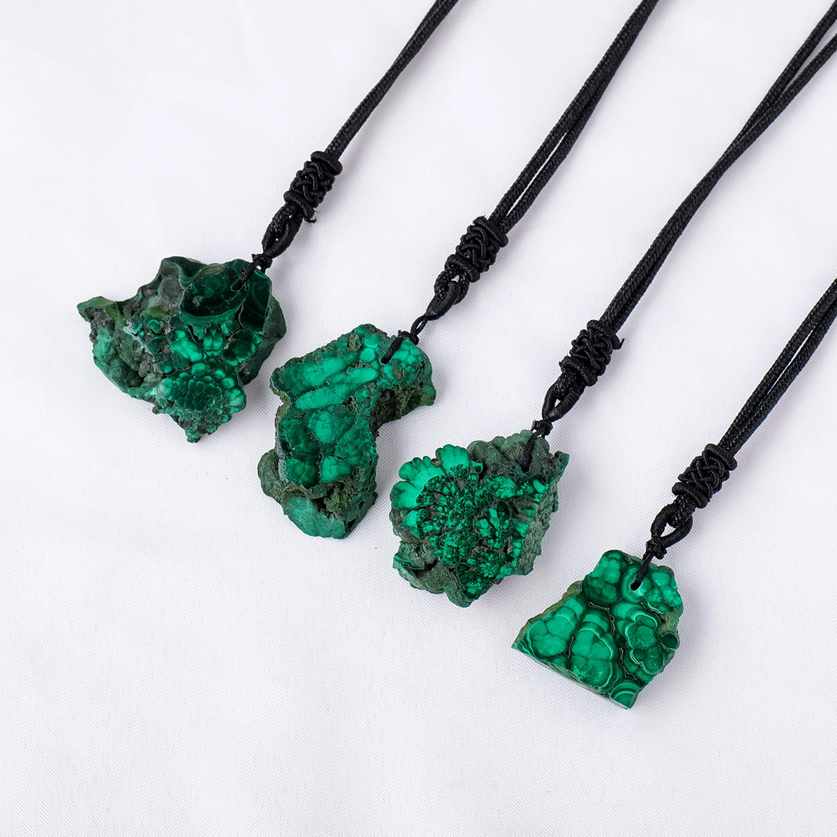 Wholesale natural high quality crystal irregular shape malachite pendant decoration gifts
Wholesale natural high quality crystal irregular shape malachite pendant decoration gifts