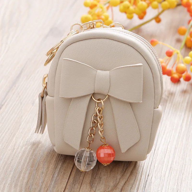 Korean version key satchel for Lady with bow pendant zipper small purse mini purse wholesale
Korean version key satchel for Lady with bow pendant zipper small purse mini purse wholesale