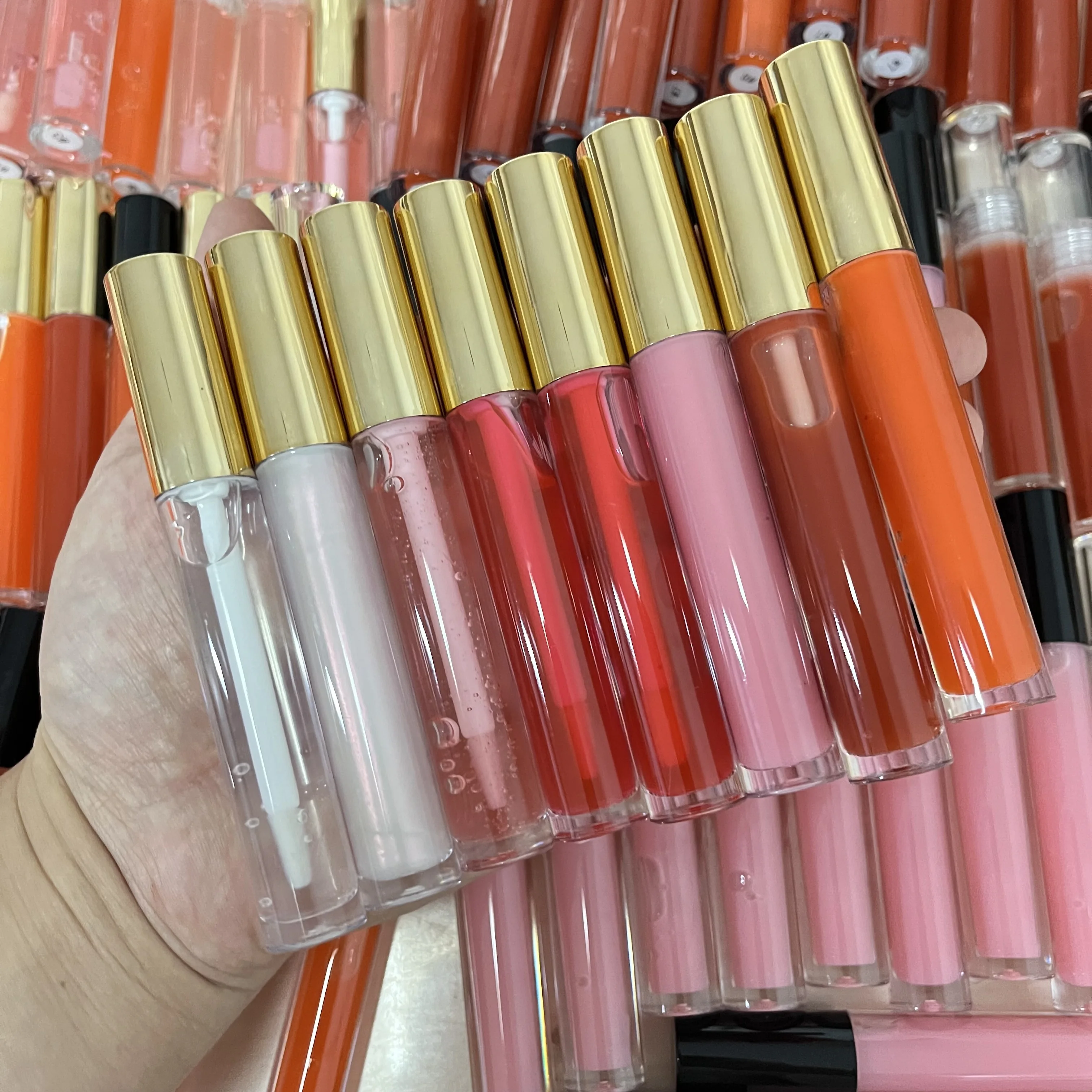 Wholesale transparent lip gloss tube vegan lip plumper custom logo make your own lip gloss
Wholesale transparent lip gloss tube vegan lip plumper custom logo make your own lip gloss