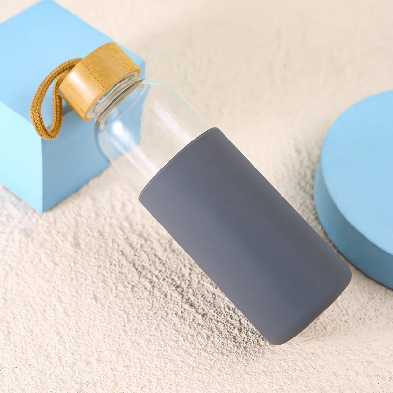 Amazon hot-sale Creative glass with rope wooden lid solid color silicone sleeve protective glass bottle
Amazon hot-sale Creative glass with rope wooden lid solid color silicone sleeve protective glass bottle