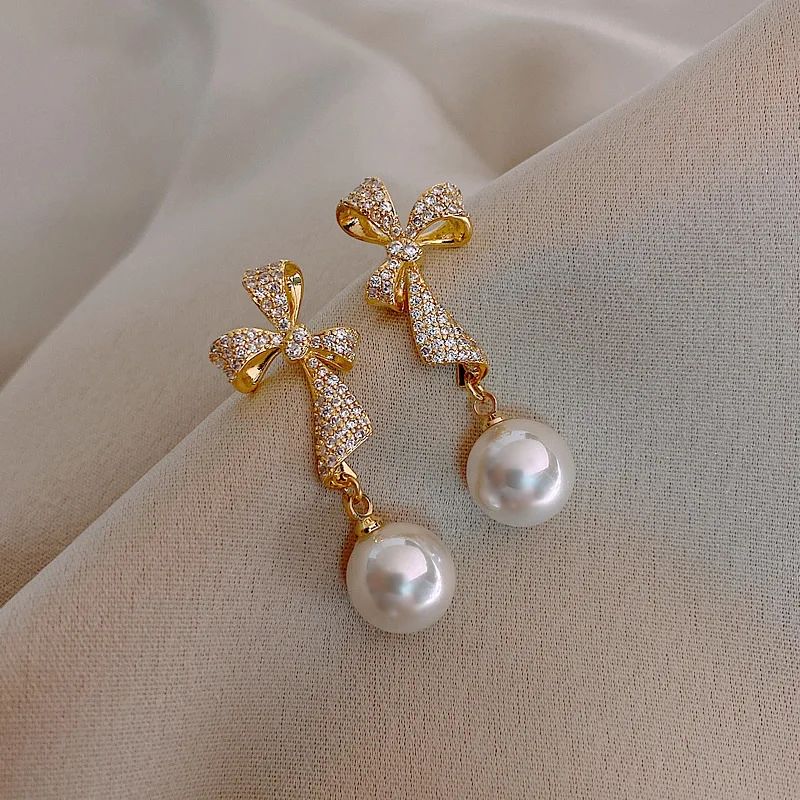 fashion trendy crystal korean bow earings pearl
fashion trendy crystal korean bow earings pearl