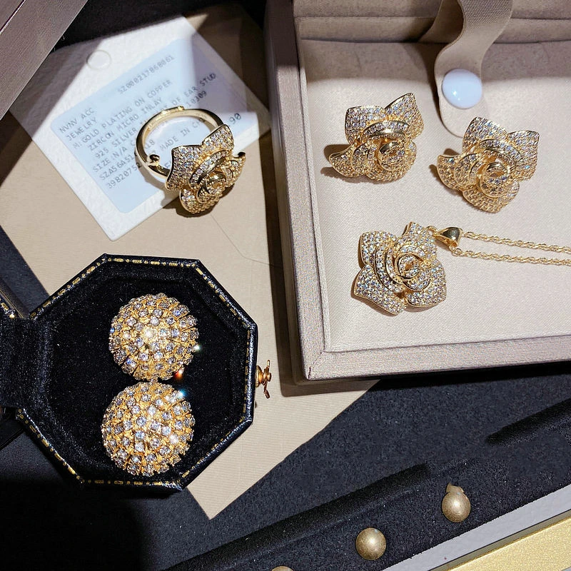 Brilliant Luxury Camellia Gemstone Earrings 18K Gold Plated Rose Flower Inlaid Zircon Ball Earrings Ring Necklace Set, Like picture
Brilliant Luxury Camellia Gemstone Earrings 18K Gold Plated Rose Flower Inlaid Zircon Ball Earrings Ring Necklace Set, Like picture