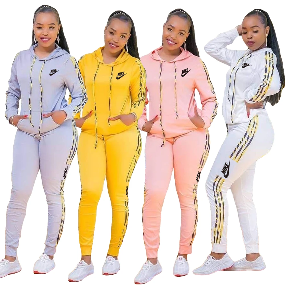 Popular Style Nike Side Strip Striped Print Casual Lady Hooded Pocket Sweatshirt And Trousers Fall 2 Piece Set Jogger Sportswear 
Popular Style Nike Side Strip Striped Print Casual Lady Hooded Pocket Sweatshirt And Trousers Fall 2 Piece Set Jogger Sportswear
