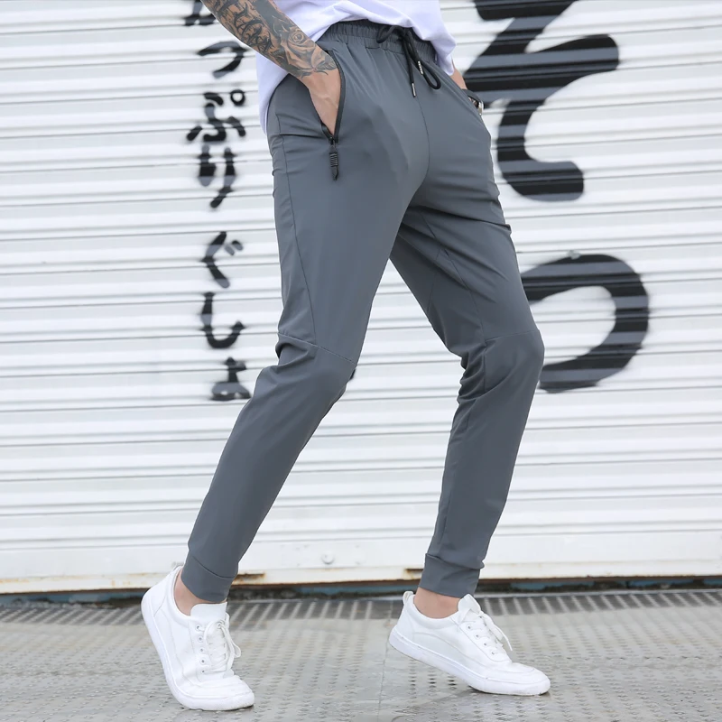 Running Gym Trousers Men Silk Breathable Workout Sports Sweatpants Drawstring Man Joggers Pants
Running Gym Trousers Men Silk Breathable Workout Sports Sweatpants Drawstring Man Joggers Pants